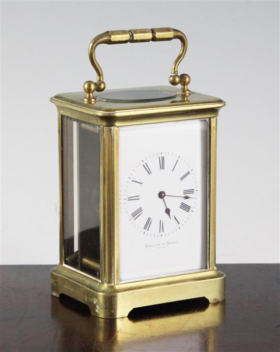 A French brass carriage timepiece, retailed by Hamilton and Inches, height to handle 14.5cm